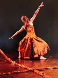 Dancer extending her arms